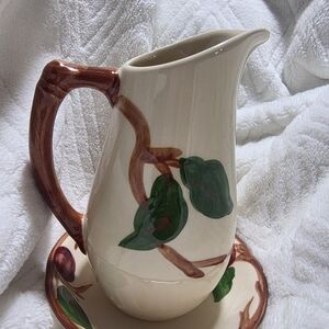 Vintage Franciscan Apple pattern pitcher and saucer set. 